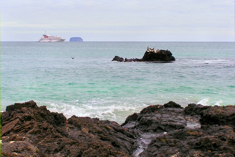 Galapagos landscape with cruise ship