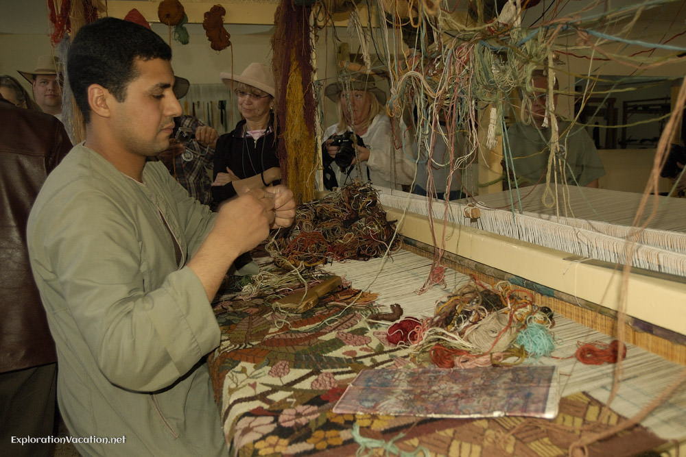 man weaving carpets