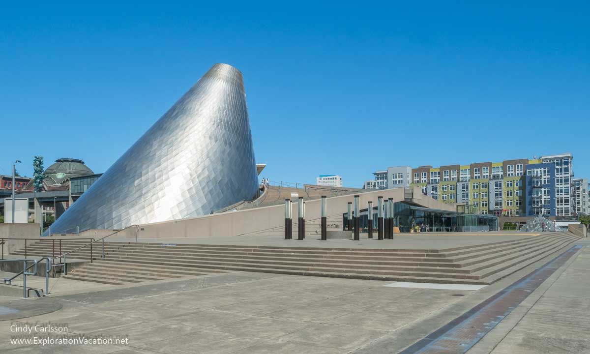 Photo of the Tacoma Museum of Glass with the cone appearing to lean into the museum itself &copy; Cindy Carlsson at ExplorationVacation.net