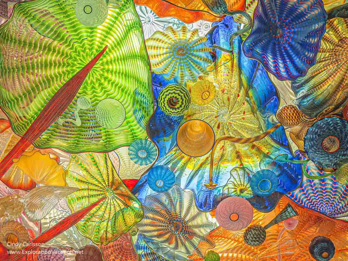 Photo looking up at the Seaform Pavilion ceiling&rsquo;s Chihuly glass forms on the Chihuly Bridge of Glass in Tacoma, Washington &copy; Cindy Carlsson at ExplorationVacation.net