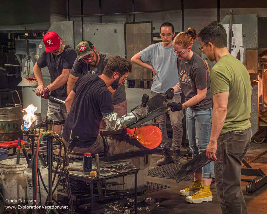 Photo of a group of people working on a piece of glass at the Museum of Glass in Tacoma, Washington &copy; Cindy Carlsson at ExplorationVacation.net