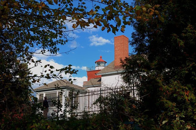 View of the lighthouse from below the fence.