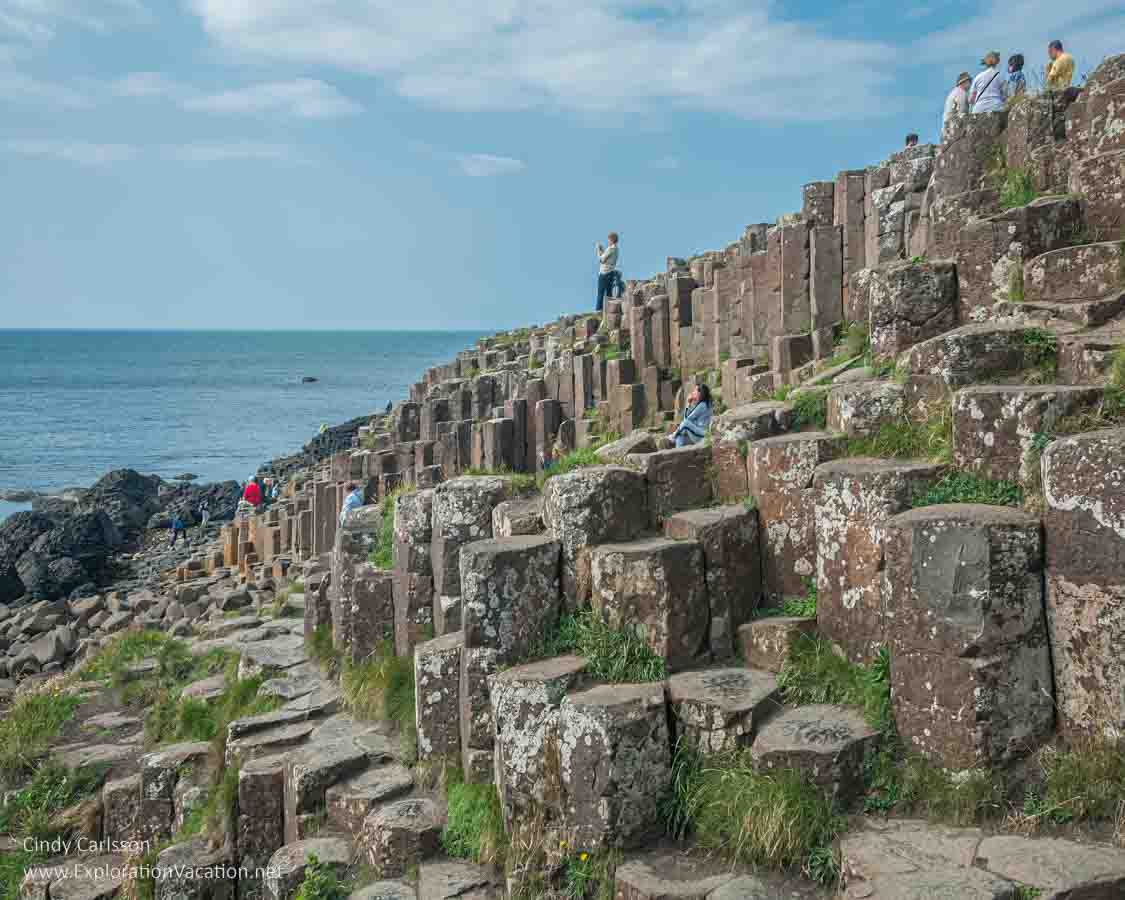 photo of people walking on the causeway at the Giant's Causeway UNESCO World Heritage site in Northern Ireland &copy; Cindy Carlsson - ExplorationVacation.net