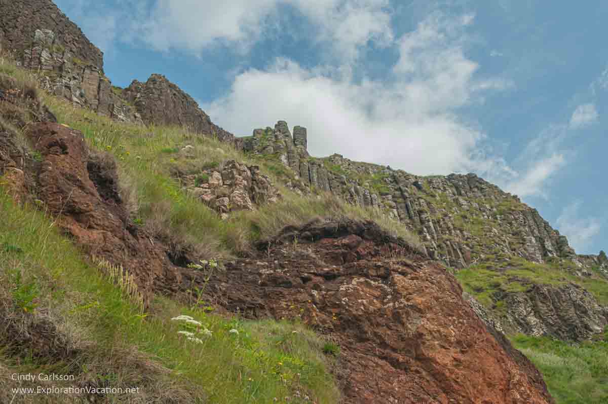 photo looking up toward the top of the Amphitheater rock formation at the Giant's Causeway UNESCO World Heritage site in Northern Ireland &copy; Cindy Carlsson - ExplorationVacation.net