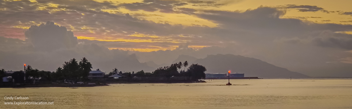photo of sunset over the bay from the restaurant at the Royal Tahitian n Papeete, French Polynesia &copy; Cindy Carlsson at ExplorationVacation.net