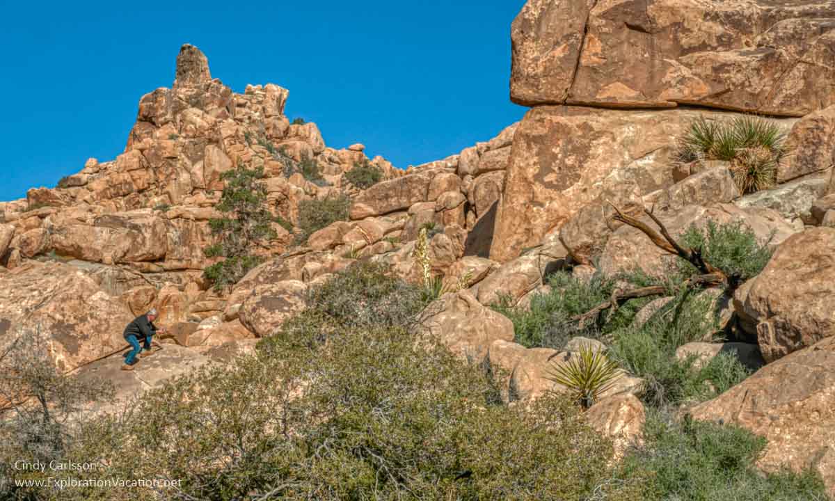 Man on rocks in desert landscape