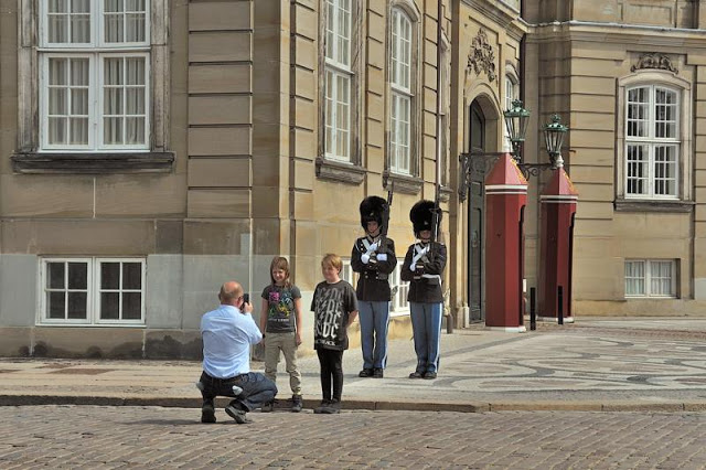 Posing for pictures with the Royal Danish Life Guards at Amalienborg Slot royal palace in Copenhagen, Denmark - ExplorationVacation.net 6-DSC_2353