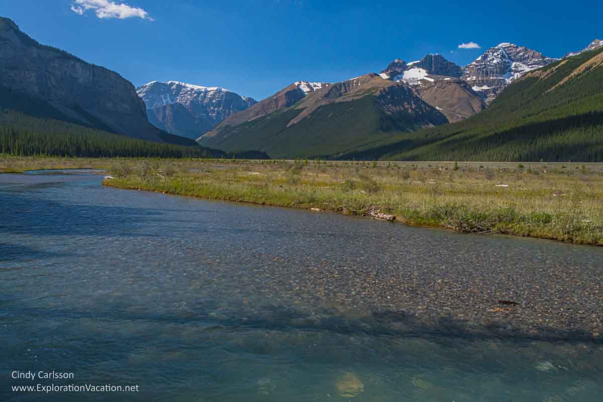 Photo of water and mountains near the beginning of the Beauty Creek trail in Jasper National Park, part of the Canadian Rocky Mountain Parks UNESCO World Heritage site &copy; Cindy Carlsson ExplorationVacation.net