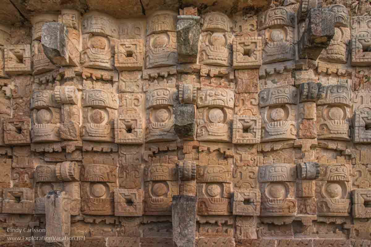 photo of stone masks that depict the rain god Chaac at the Codz Poop (Palace of the Masks) at Kabah Mexico, part of the Uxmal UNESCO World Heritage site © Cindy Carlsson at ExplorationVacation.net