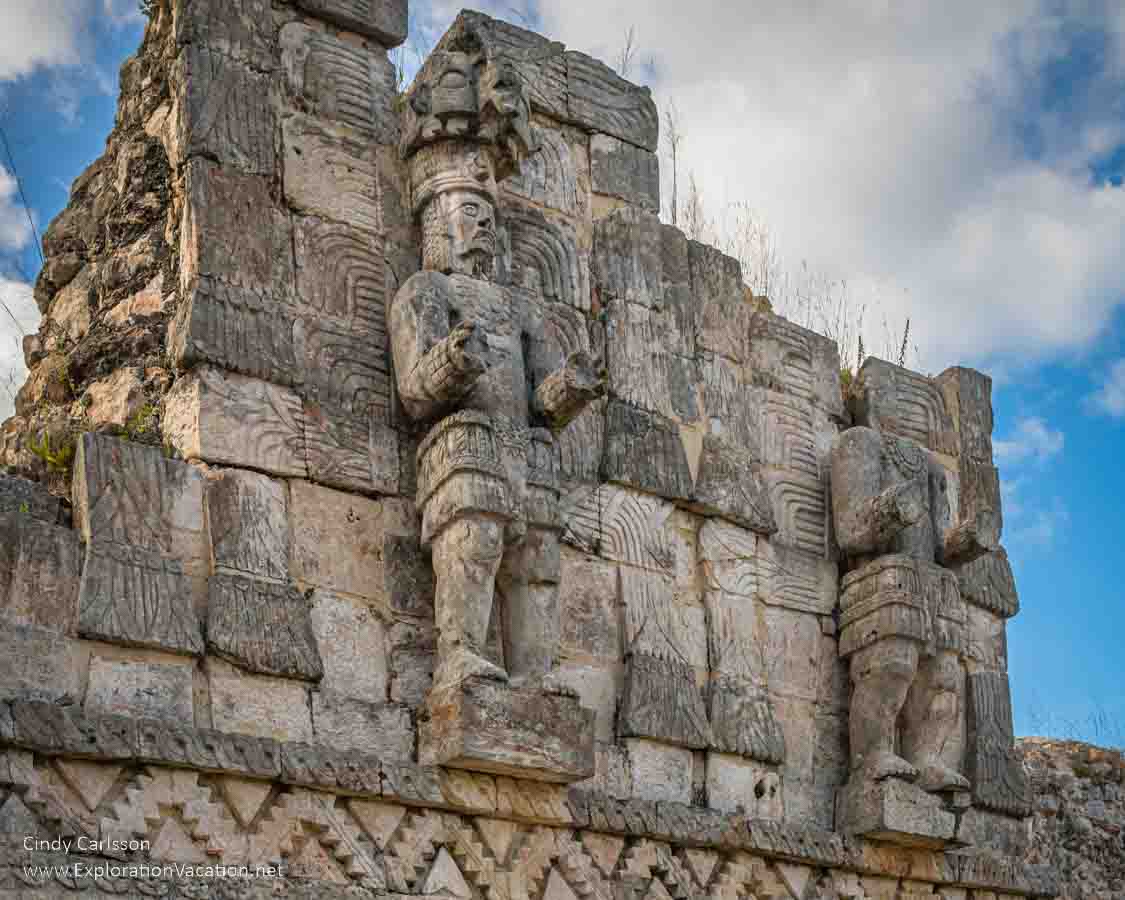 photo of statues at the Codz Poop (Palace of the Masks) at Kabah Mexico, part of the Uxmal UNESCO World Heritage site © Cindy Carlsson at ExplorationVacation.net