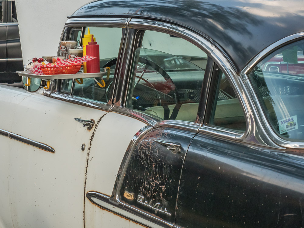 photo of a vintage car with a drive-in food tray on the window at the 2018 Back to the 50s Weekend in Minnesota &copy; Cindy Carlsson ExplorationVacation.net