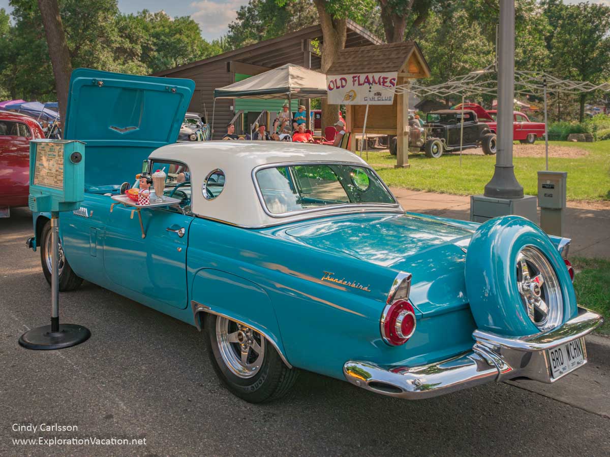 photo of a 1950s Thunderbird with 1950s drive-in style food tray and order stand at the 2018 Back to the 50s Weekend in Minnesota &copy; Cindy Carlsson ExplorationVacation.net