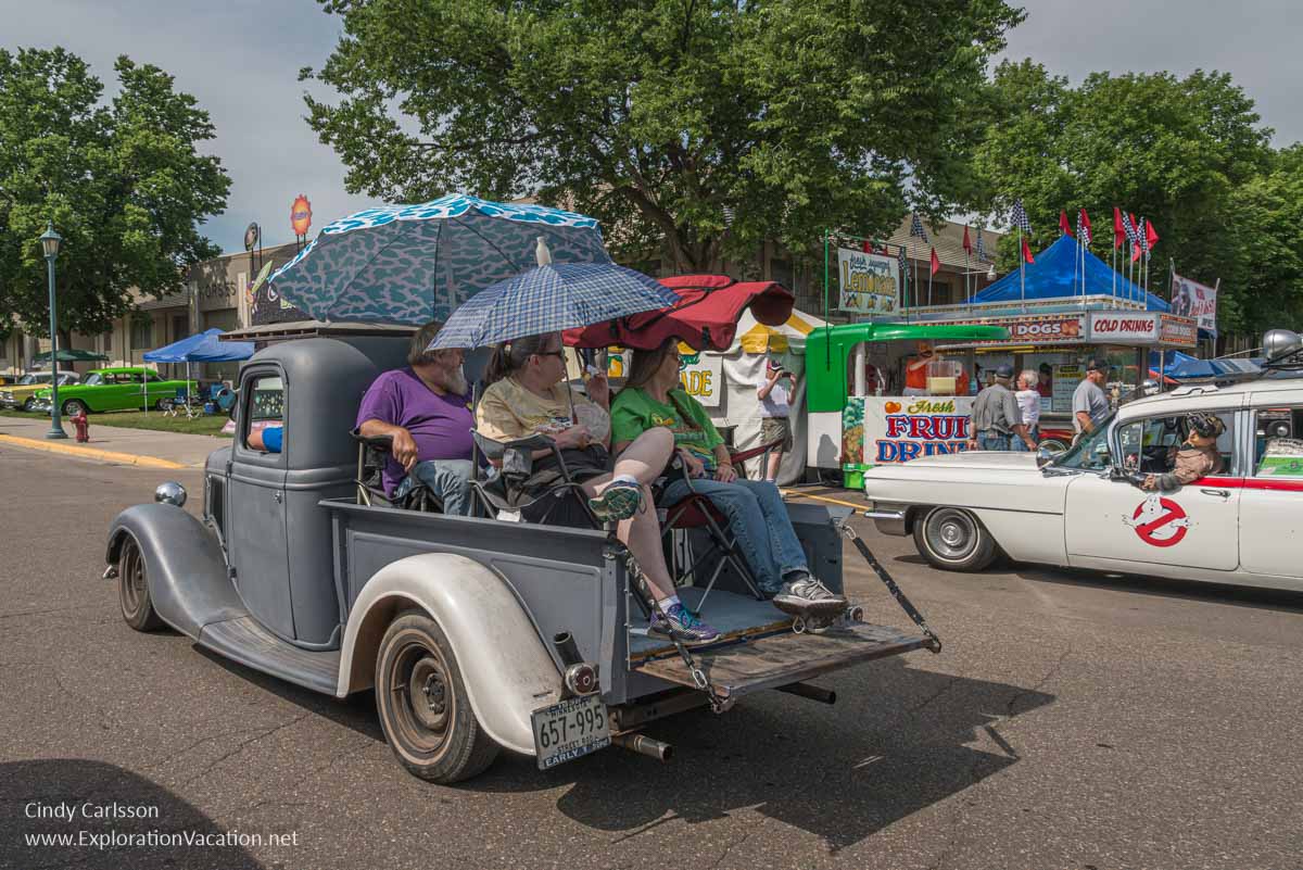 photo of people riding in the back of a vintage pickup truck at the Back to the 50s weekend in St Paul Minnesota in 2015 &copy; Cindy Carlsson ExplorationVacation.net