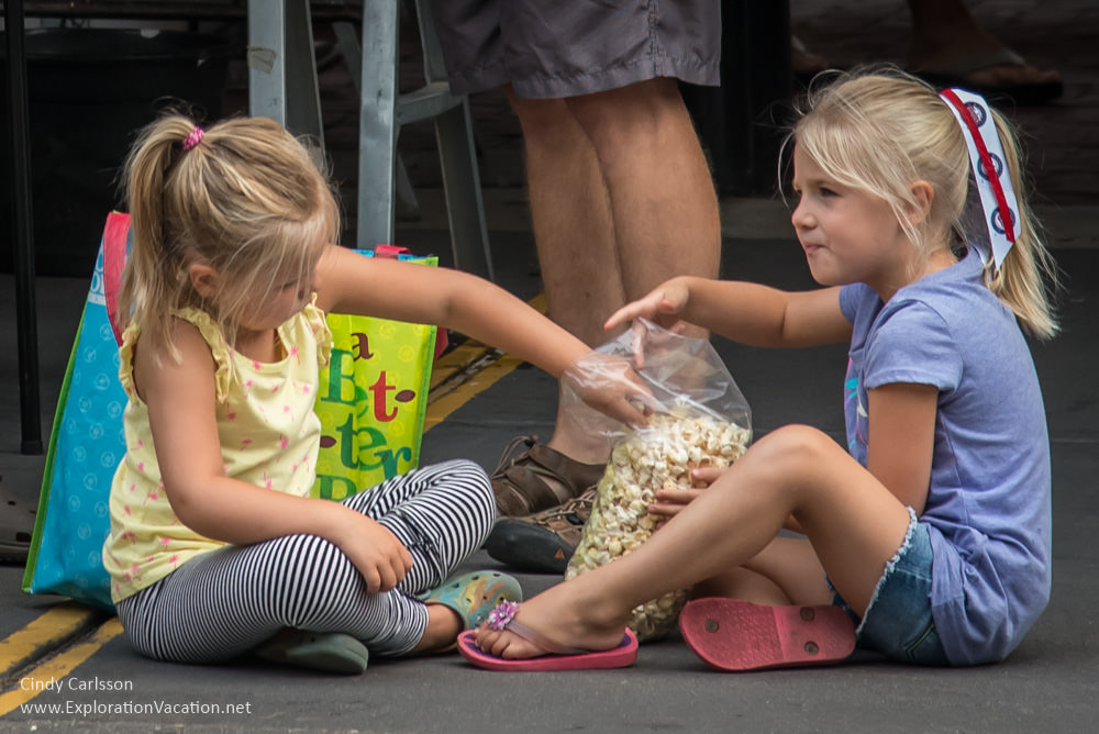 girls eating popcorn Saint Paul farmers market 