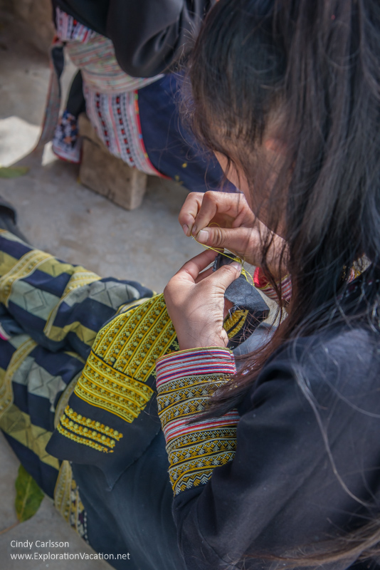 Red Dao woman embroidering