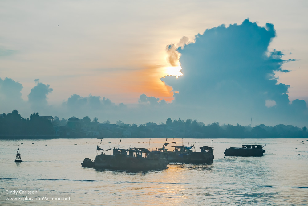 boats at dawn on the Mekong Delta Vietnam - ExplorationVacation.net