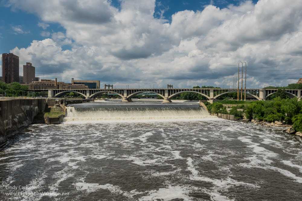 St Anthony Falls from the Stone Arch Bridge during a Segway tour of the historic Mill District in Minneapolis, Minnesota - ExplorationVacation