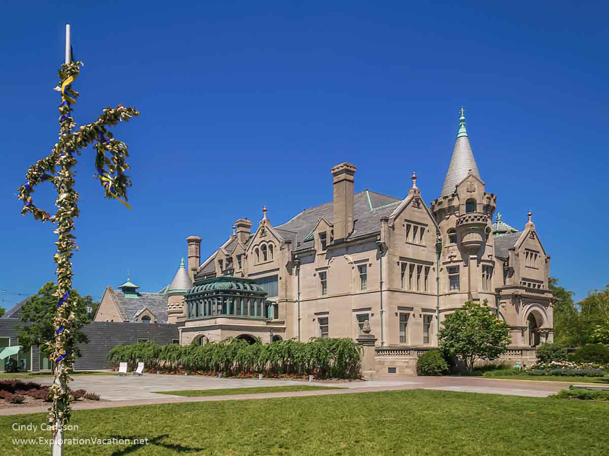 large castle-like mansion of the American Swedish Institute with a maypole