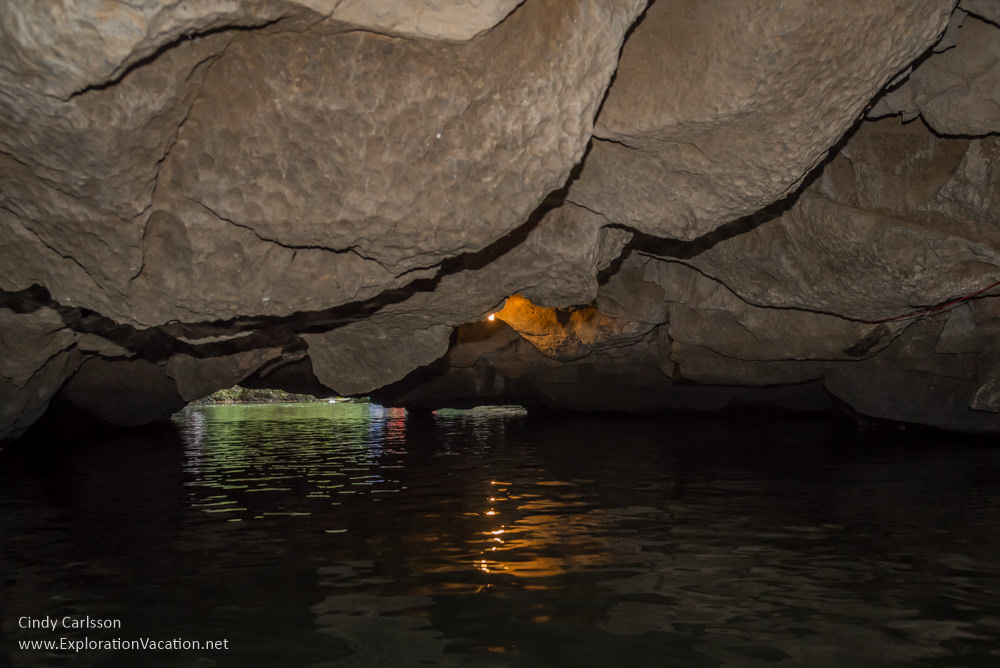 Photo of a rowboat in a cave in Trang An Vietnam - ExplorationVacation.net