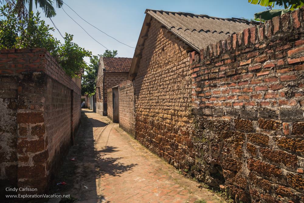 Laterite buildings Duong Lam ancient village Vietnam - ExplorationVacation