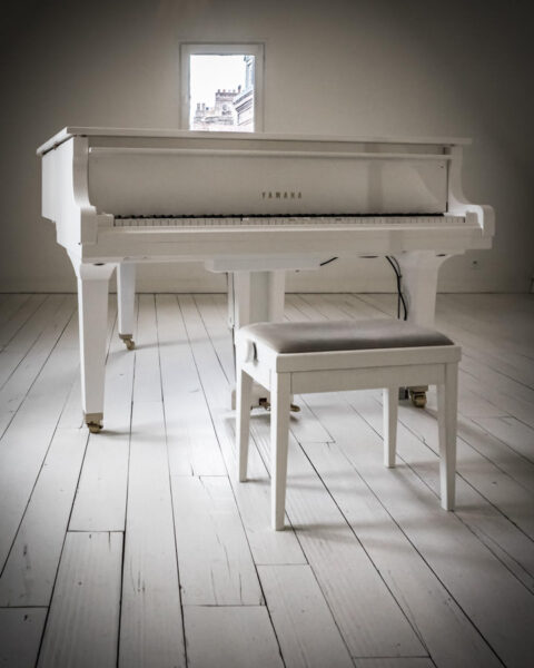 white piano in a white room
