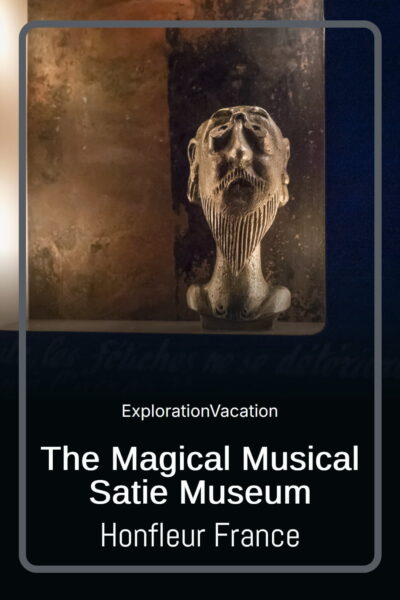 Eerie bust of Satie, with text "The Magical Musical Satie Museum Honfleur France - ExplorationVacation"