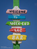 Sign for the Week-End Lac Bar near the beach on Lac Bay in Bonaire - ExplorationVacation.net