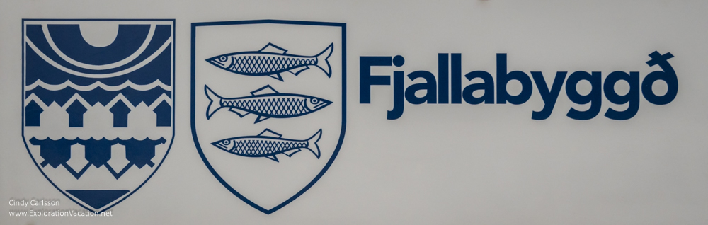 sign with coat of arms of the two cities that form Fjallabygg&eth; 