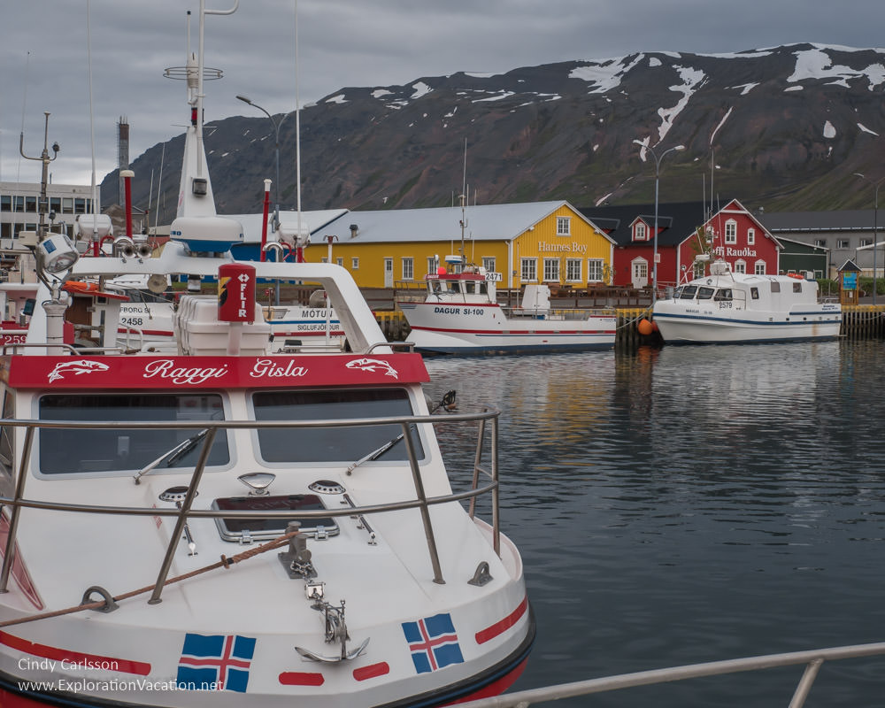 Colorful boats and buildings at the old harbor in Siglufjörður, Iceland