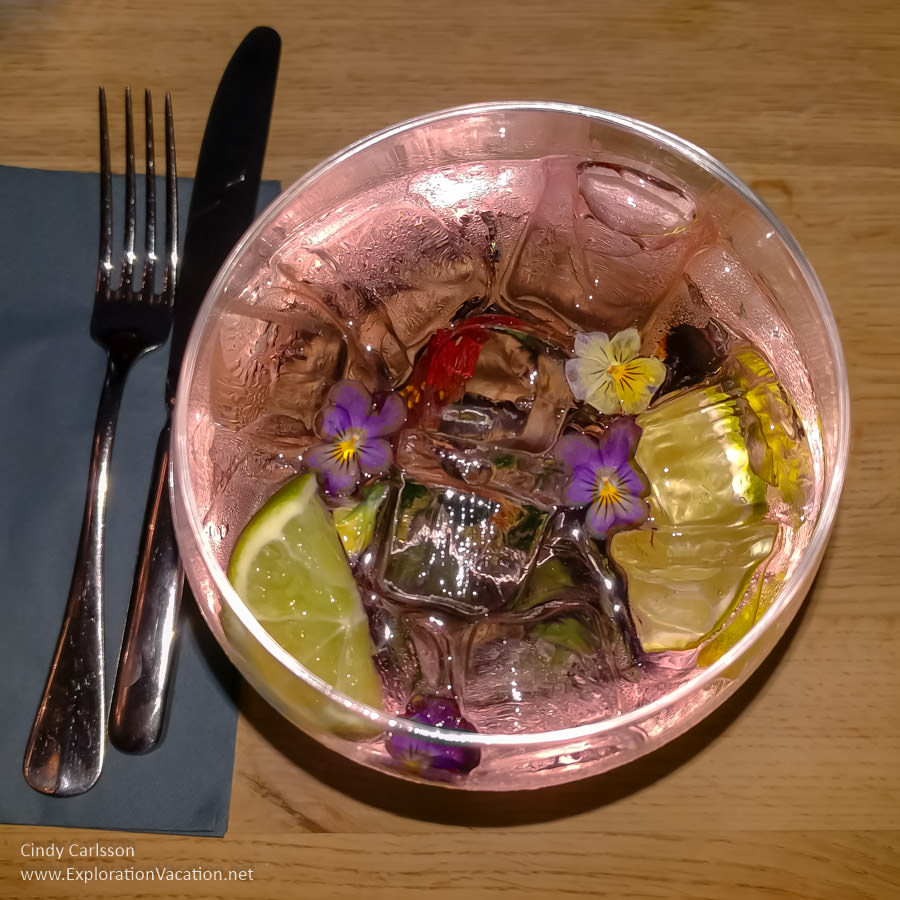 view down into a pink drink with flowers