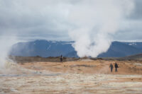 view of steaming vent with people watching