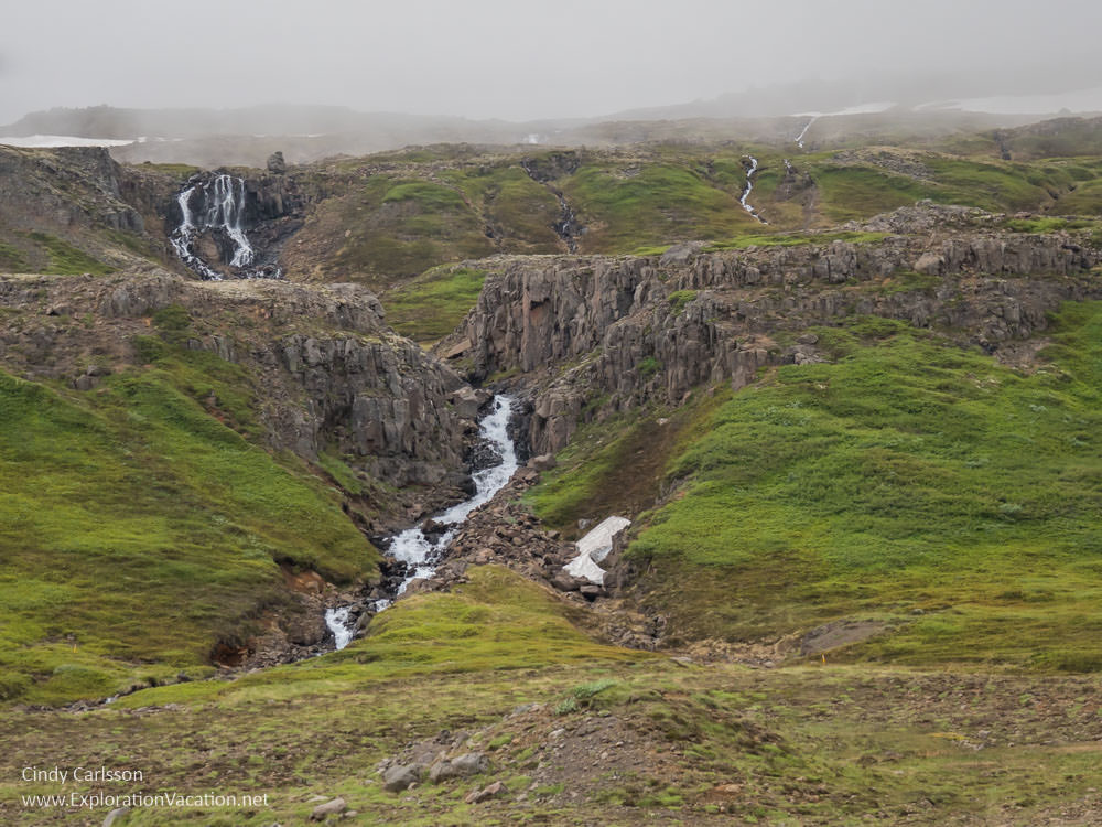 waterfalls in green hillsides