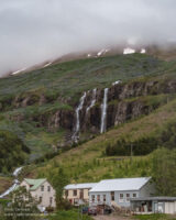 Waterfall above houses
