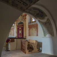 interior view of the synagogue through an archway