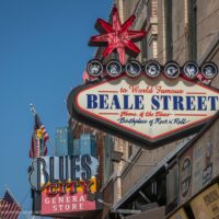 colorful neon signs on Beale Street during the day