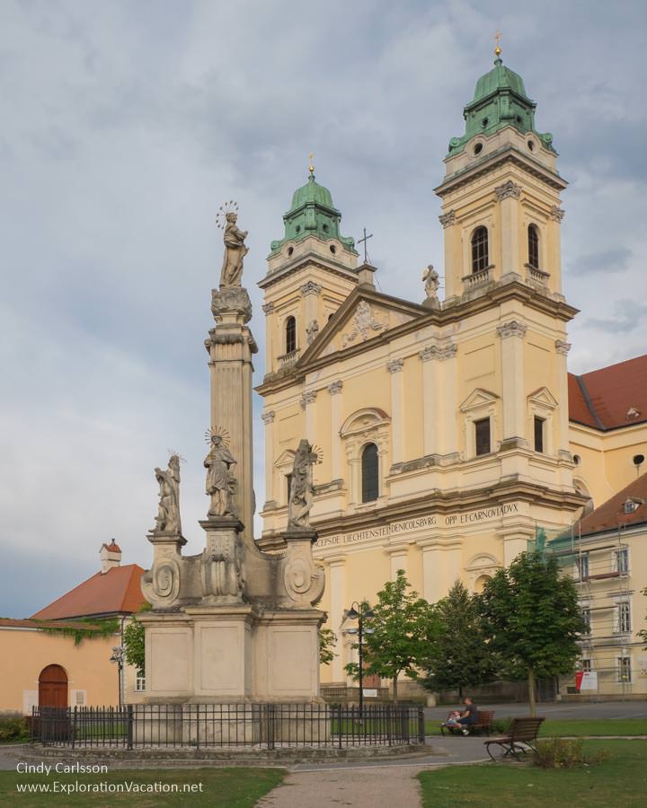 fountain and church with two towers