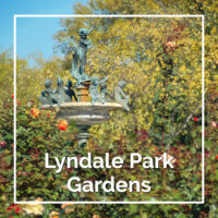 Top of the fountain above roses with text "Lyndale Park Gardens"