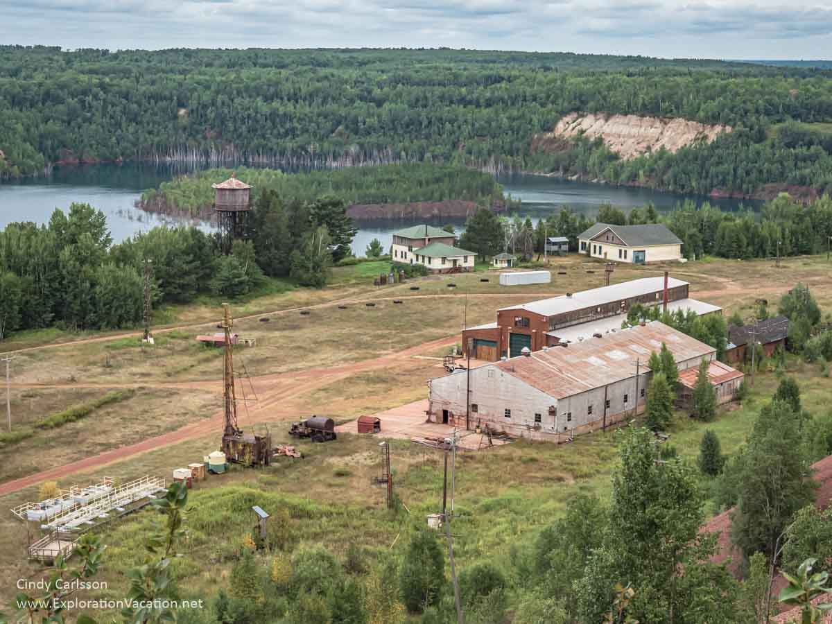 Over view of mine buildings with pit lake in background