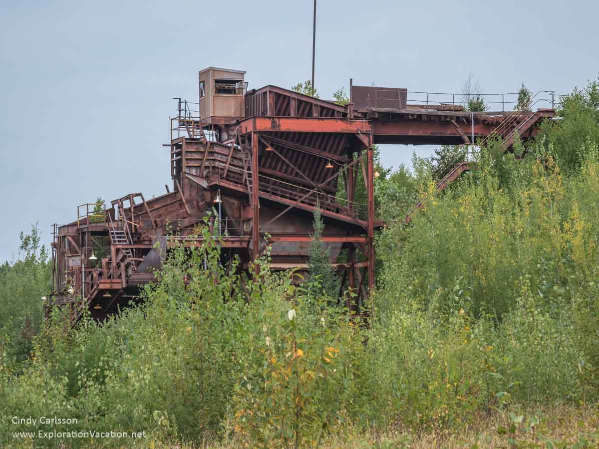 rusty structure used to transfer ore from trucks to a conveyor