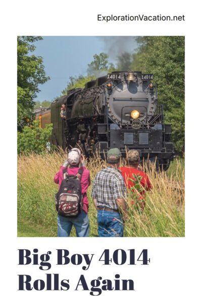 A steam locomotive with people watching it roll by and text "Big Boy 4014 Rolling across the USA - ExplorationVacation.net."