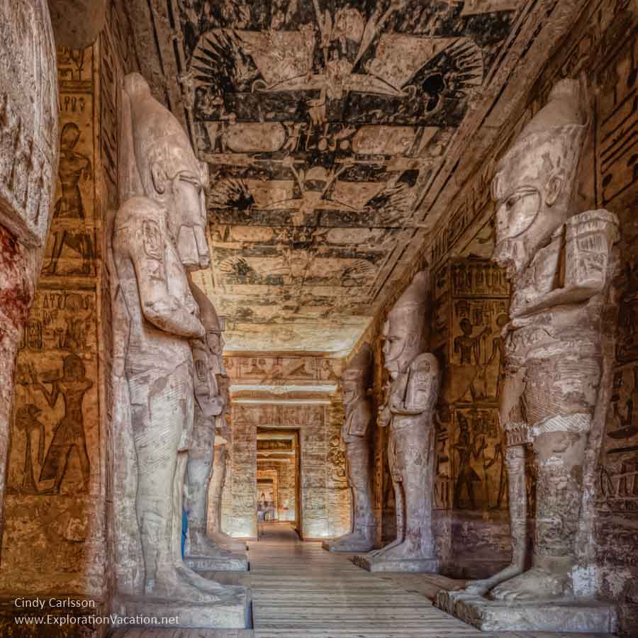 interior of temple with huge carvings standing in a line