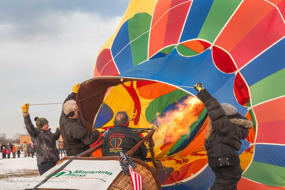 Photo of flames shooting into a balloon to heat the air inside enough to raise it at the Hudson Hot Air Affair in Wisconsin. (Photo &copy; Cindy Carlsson on ExplorationVacation.net)