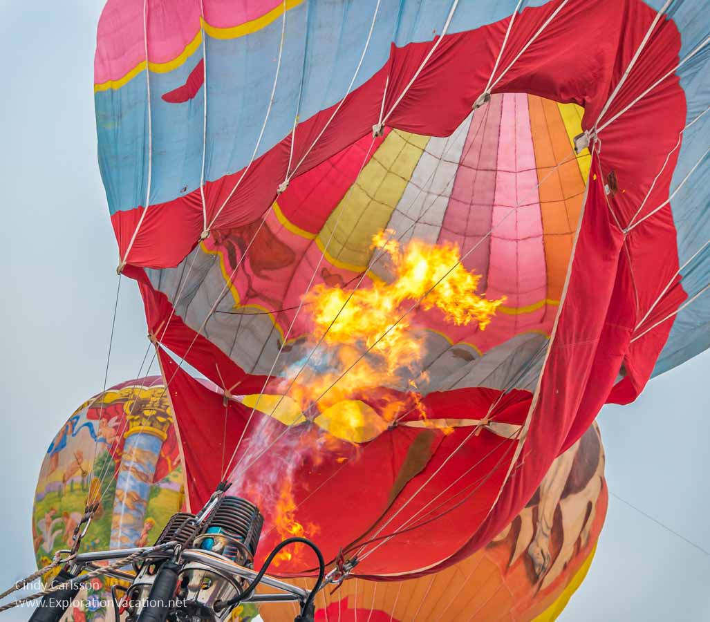 flames shoot up into a hot air balloon