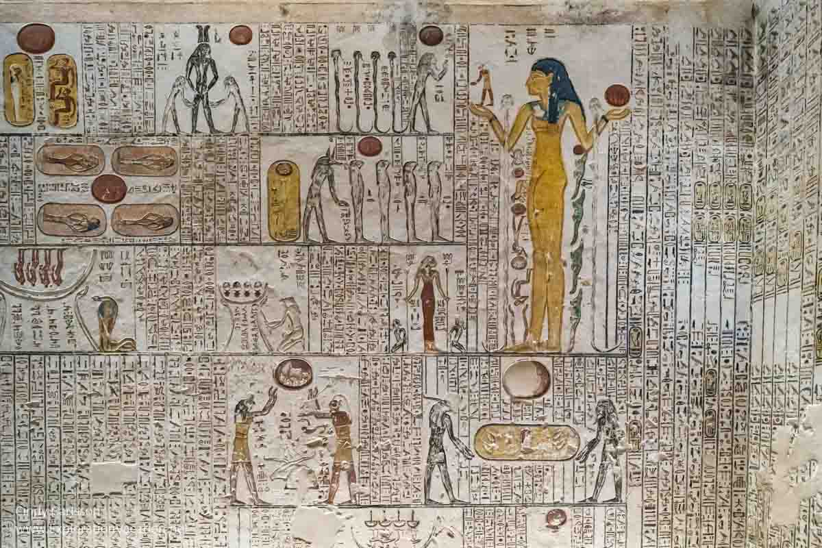 a goddess and figures painted inside a tomb