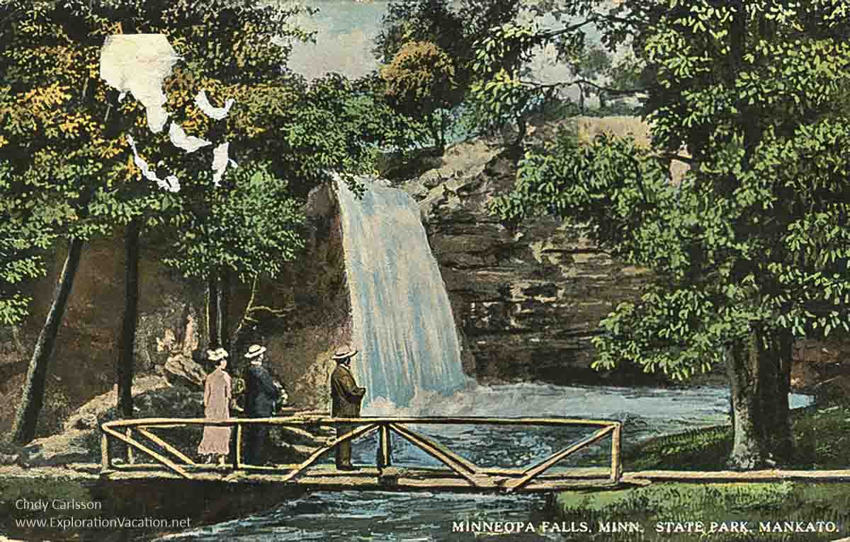 1915 postcard with bridge and people standing looking at a waterfall