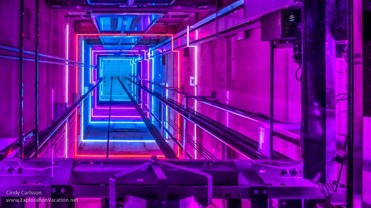 bright colored lights above an elevator car