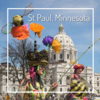 state capital with street performer and text "St Paul, Minnesota"