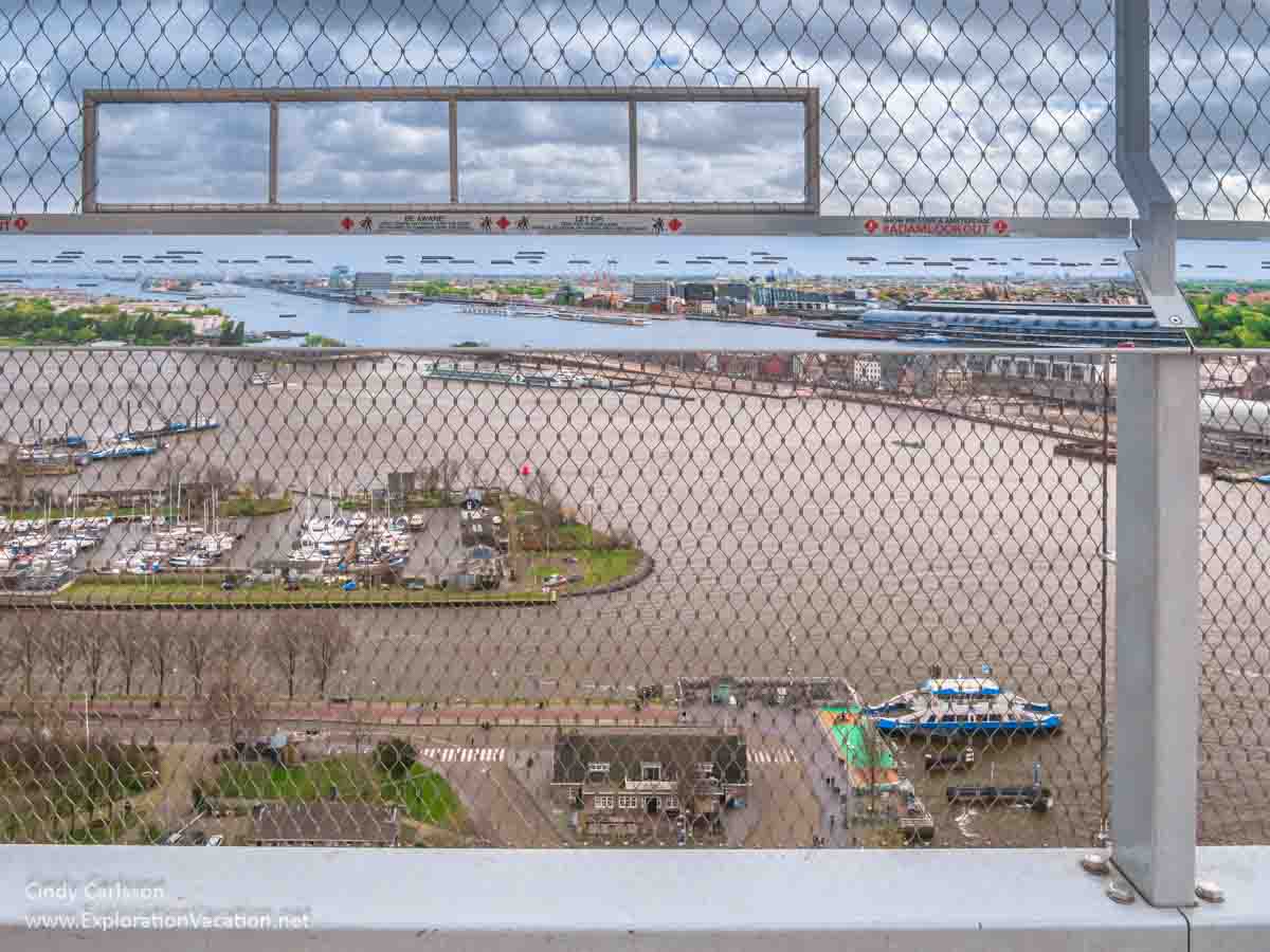 view of a riverfront from above through a fence