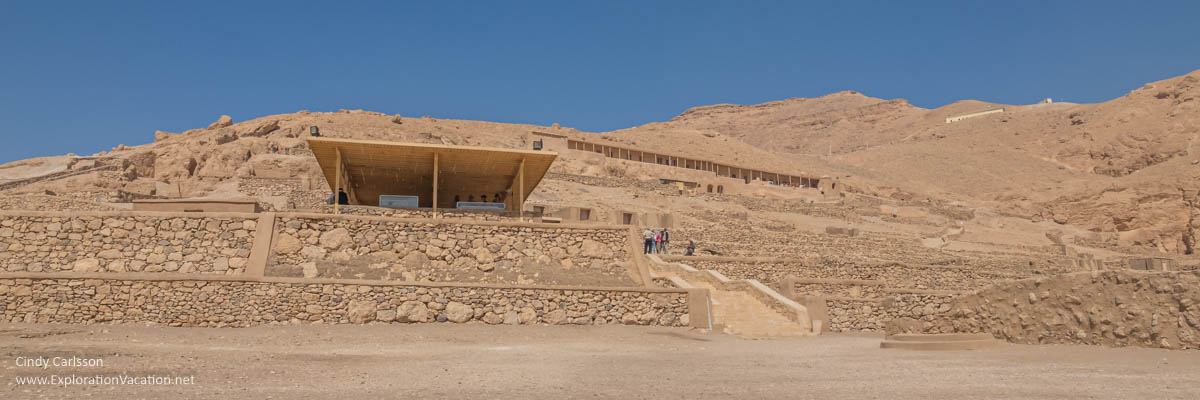 panorama of a hillside with tombs and covered patios