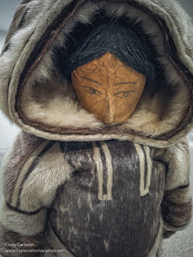 Doll in seal skin clothing at the WAG-Qaumajuq